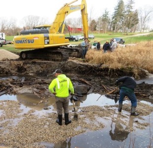 Spreading a stone bed